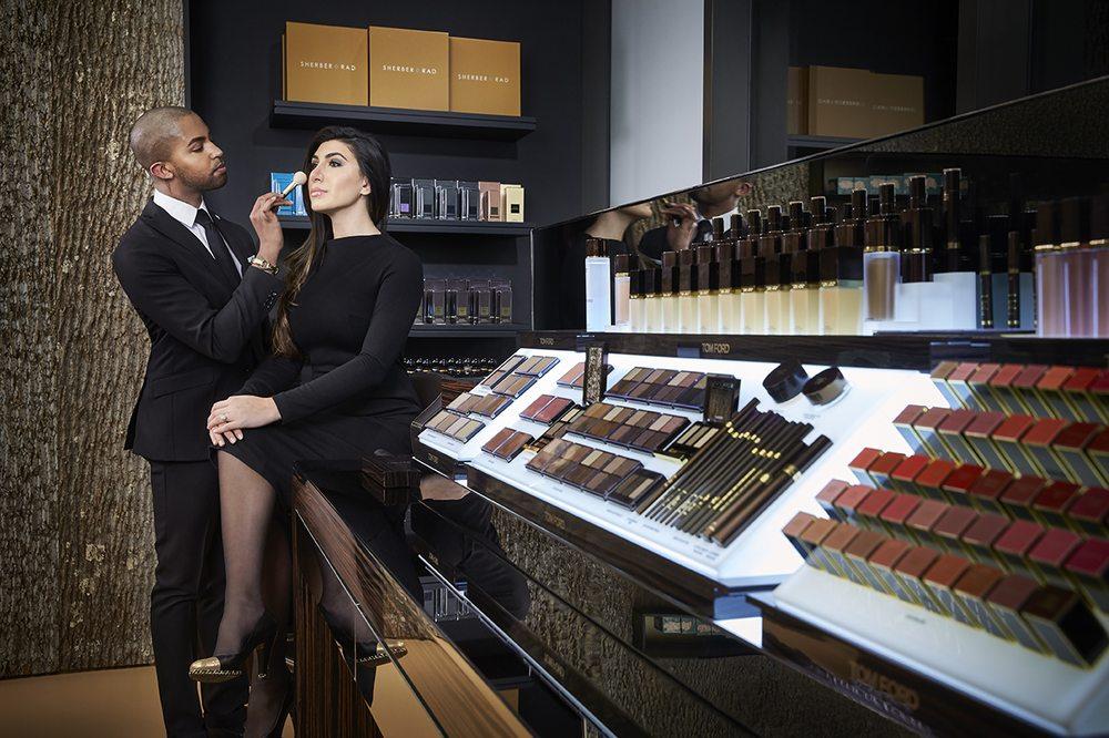 Makeup artist and client both in black attires